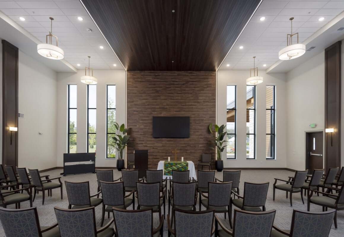 Chapel with seating, altar, and modern lighting