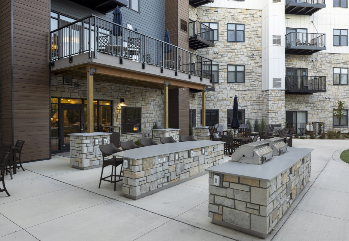 Outdoor grilling station with bar seating