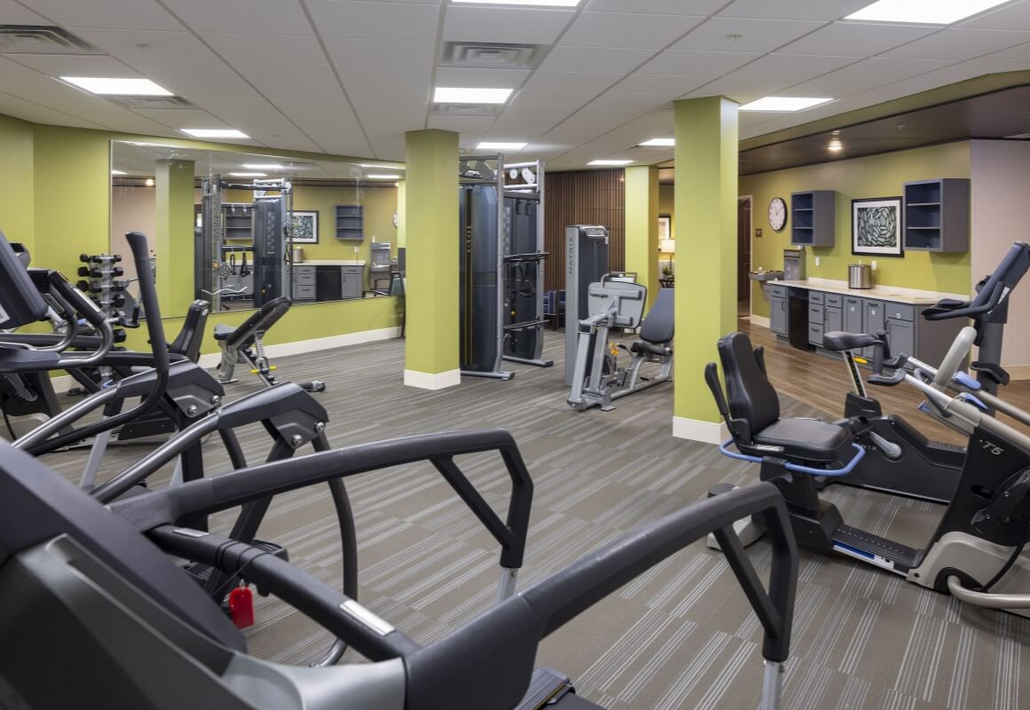 Fitness room with cardio machines and strength training gear