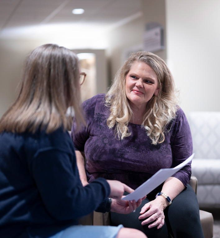 Caregiver Services Program Coordinator talks about available resources to a caregiver.