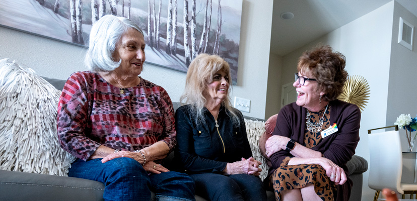 A friend visits her friend in her Assisted Living apartment, along with the Executive Director, on the Lino Lakes campus.