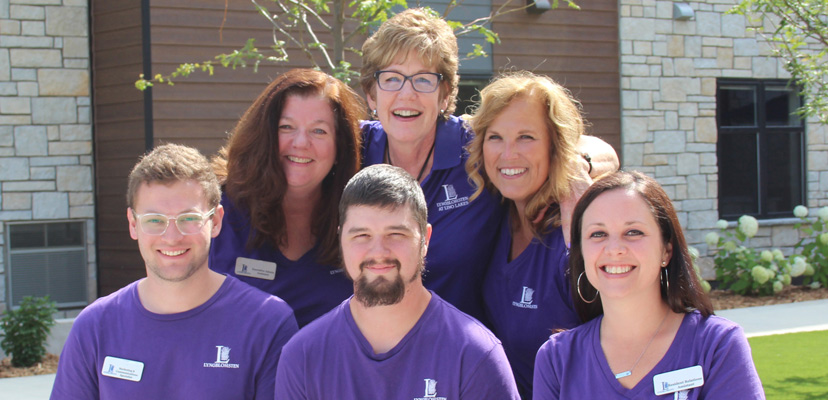 Como Park and Lino Lakes staff pose in the central courtyard of the Lino Lakes campus during opening week of the campus back in July of 2023.