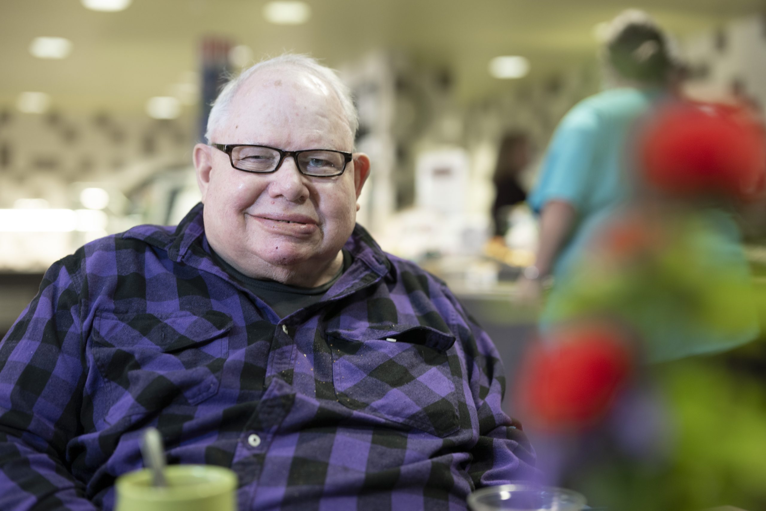 Care Center resident sitting at Anna's café & gifts