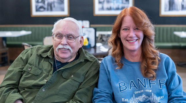 A Lyngblomsten at Lino Lakes resident and his daughter smiling and having a great time at Mikelson's Tavern.