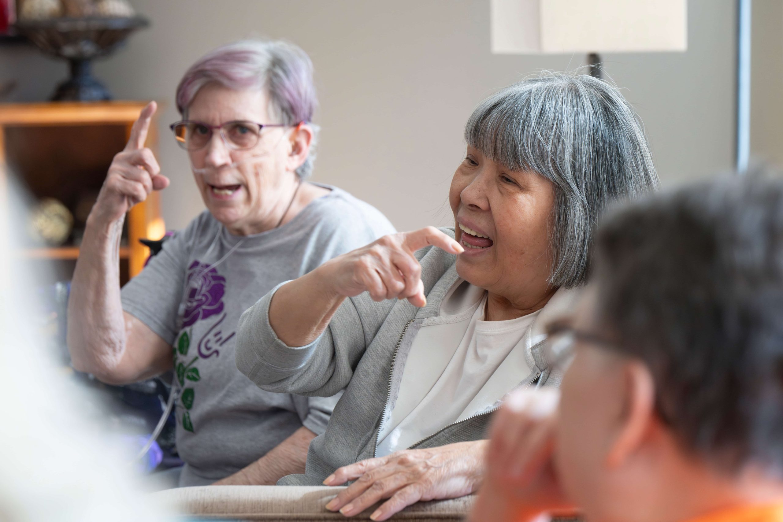 Lyngblomsten Apartments Residents Socialize using Sign Language