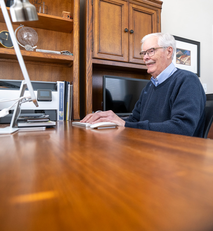 Lyngblomsten at Lino Lakes Townhome Resident Working on his Computer in his Office