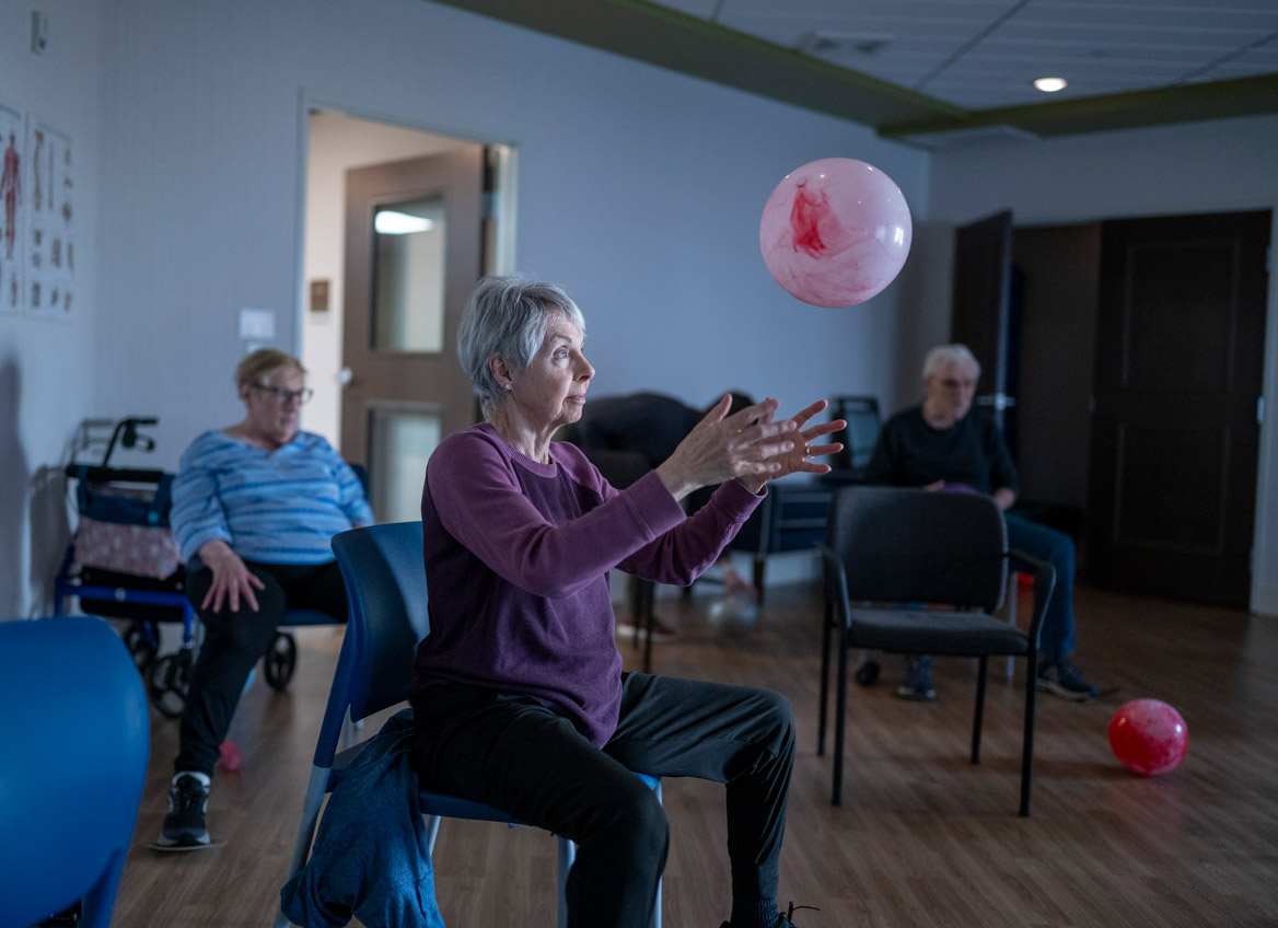 Residents Participate in an Exercise Class in the Fitness Studio