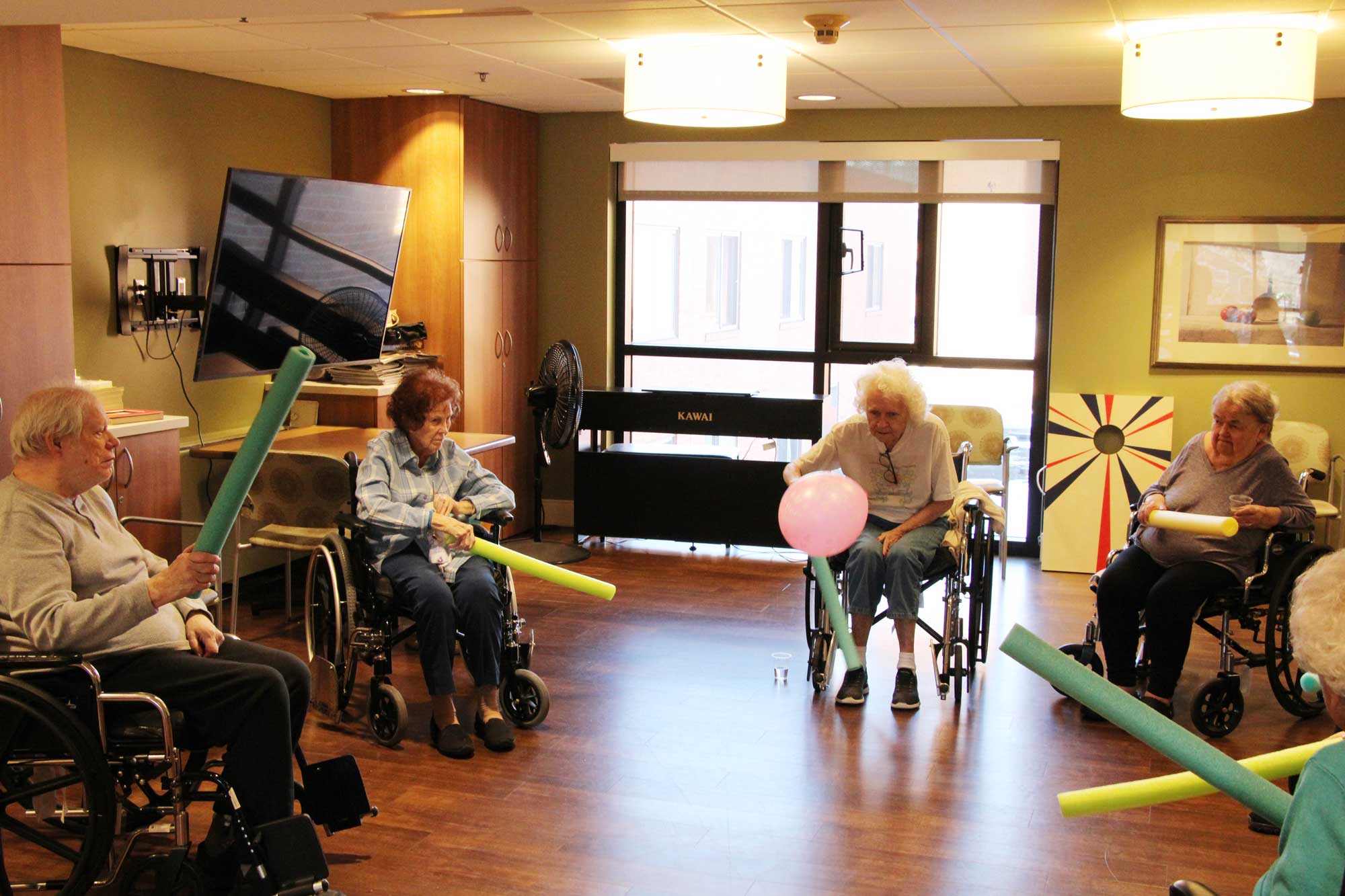 Residents Play Noodle Ball in the Lyngblomsten Care Center