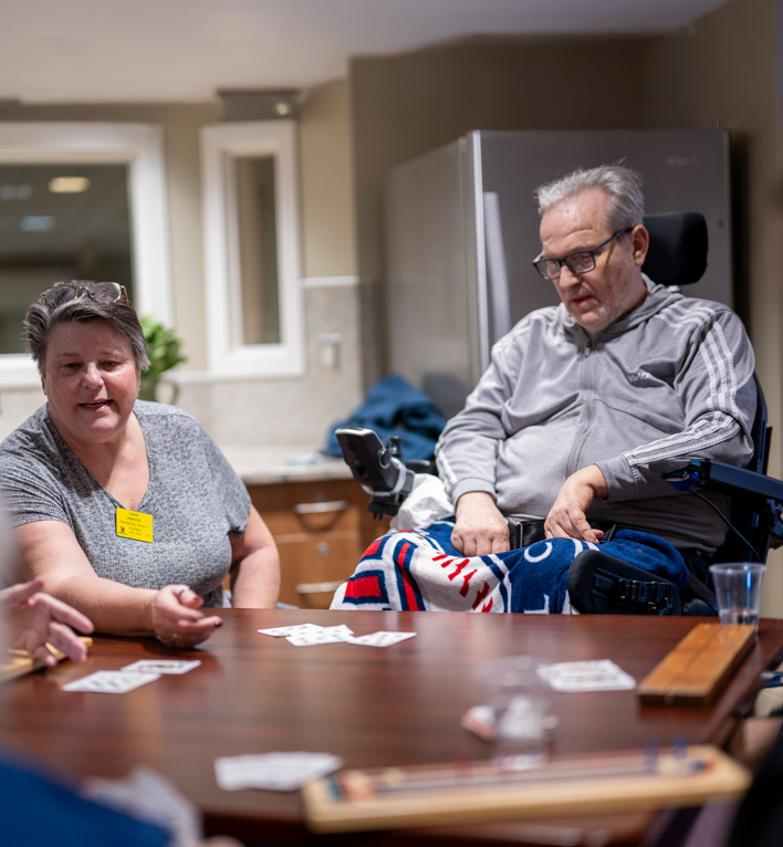 Volunteers and Residents Playing Cribbage in the Lyngblomsten Care Center